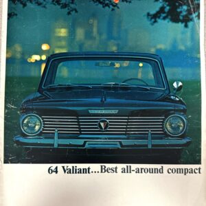 Front view of a dark blue 1964 Plymouth Valiant with a chrome grille; the caption beneath reads '64 Valiant... Best all-around compact'