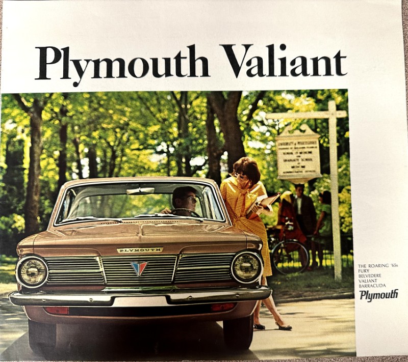 IMG_9160 | Merrick Auto Museum Vintage Plymouth Valiant ad showing a beige car in a park; a woman in a yellow dress chats with the driver beside the front grille.