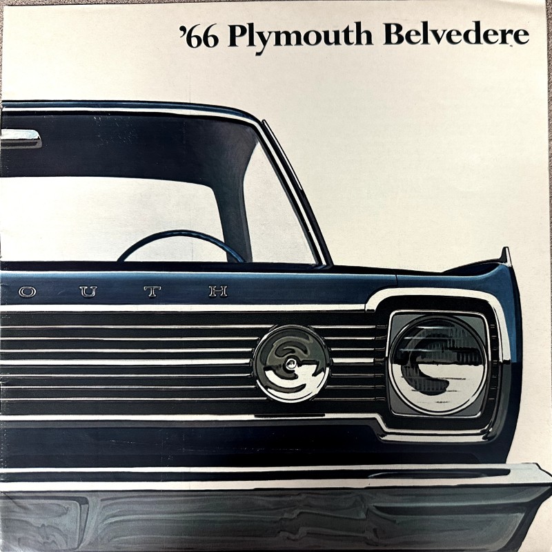 IMG_9169 | Merrick Auto Museum Front view of a blue 1966 Plymouth Belvedere with chrome grille and round headlight, seen from the passenger side.