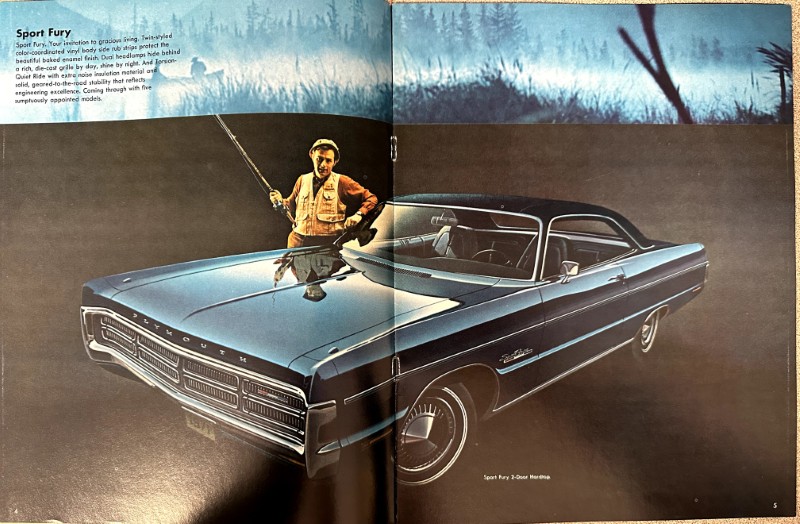 IMG_9206 | Merrick Auto Museum Blue Plymouth Sport Fury convertible in a studio photo with a man in a tan jacket standing beside the front fender.