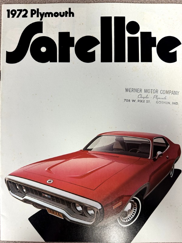 IMG_9211 | Merrick Auto Museum Cover image of a 1972 Plymouth Satellite car ad: a red coupe on a white background with a large bold 'Satellite' title at the top and a dealership stamp on the right.