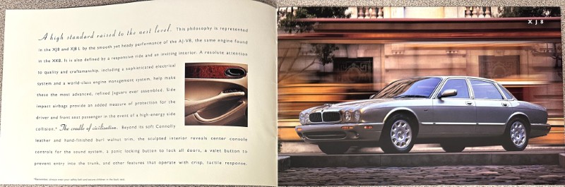IMG_9348 | Merrick Auto Museum Open magazine spread with dense text on the left page and a silver four-door sedan parked on a city street on the right page, with motion blur in the background.