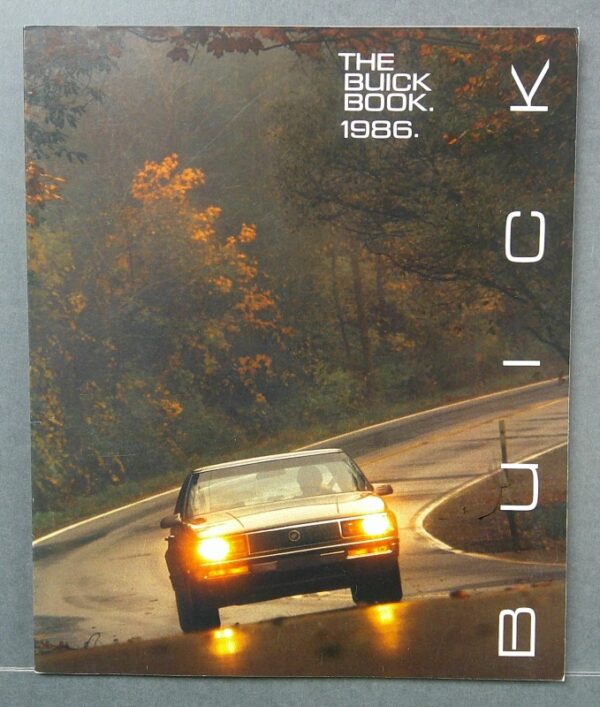 1 Custom | Merrick Auto Museum Book cover with a gold Buick on a wet, winding road and autumn trees; top-right reads 'THE BUICK BOOK. 1986.'
