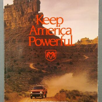 Vintage Dodge ad poster with a desert road and a red pickup, featuring the bold orange slogan 'Keep America Powerful'.