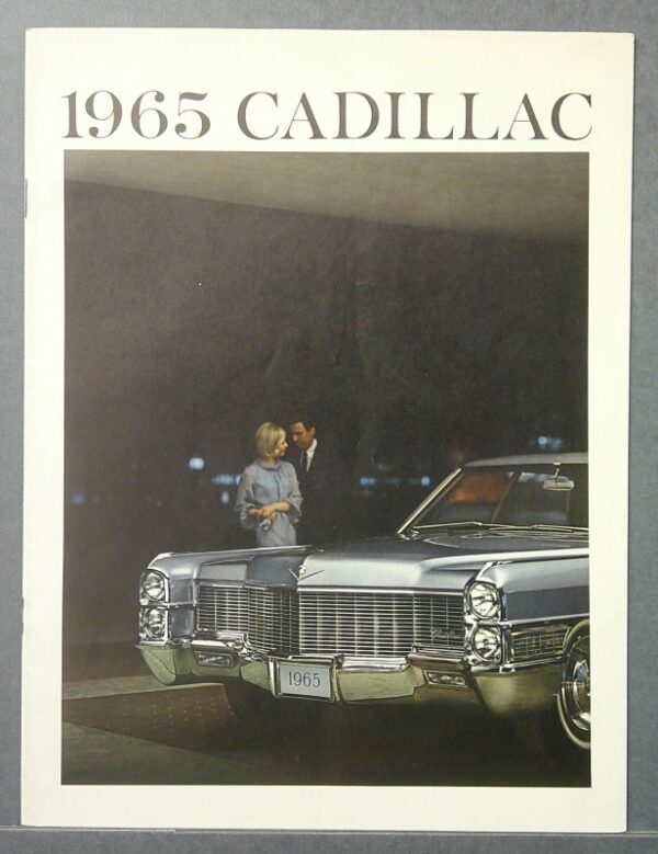 13 Custom | Merrick Auto Museum Text reads '1965 CADILLAC' above a photo of a silver 1965 Cadillac with a man and woman standing beside the car in a dim showroom.