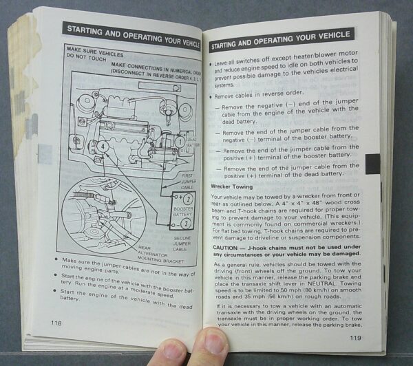 Digital Camera | Merrick Auto Museum Open car manual showing a diagram of the engine and wiring with starting instructions on the right page.