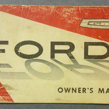 Digital Camera | Merrick Auto Museum Cover of a worn 1969 Ford owner's manual with a red and beige diagonal design
