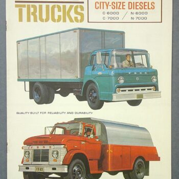 Digital Camera | Merrick Auto Museum Vintage Ford Trucks brochure page showing a blue tractor-trailer and a red delivery truck with 1963 catalog text at top left and right panels.