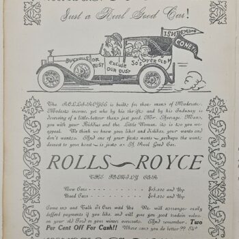 Vintage advertisement page with a patent‑car illustration, passengers in a car labeled Rolls‑Royce, and ornate floral borders that frame the text.