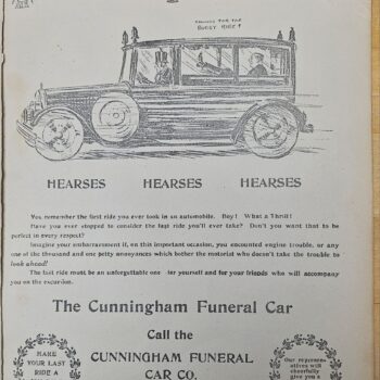 Black-and-white ad page showing a vintage funeral car with three connected hearses, driver in the cab; 'HEARSES' repeated thrice below, and promotional text for The Cunningham Funeral Car Co.