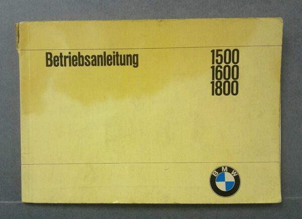 BMW1 Custom | Merrick Auto Museum Yellow BMW instruction manual cover labeled Betriebsanleitung with model numbers 1500, 1600, 1800 and a BMW roundel logo.
