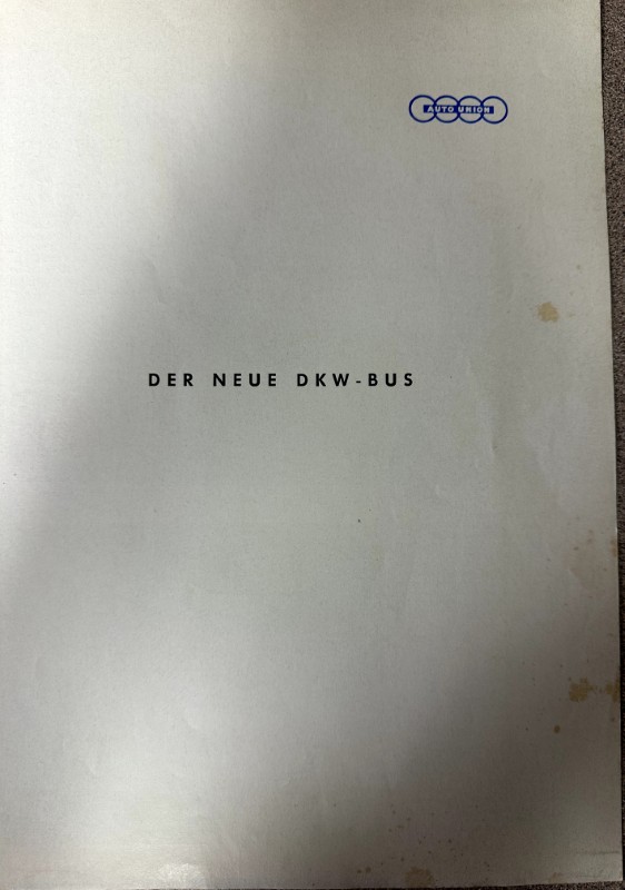 IMG_9501 | Merrick Auto Museum Page displaying the title 'DER NEUE DKW-BUS' with a small blue Auto Union logo in the top-right corner.