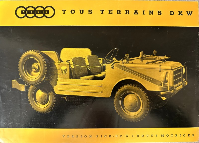 IMG_9504 | Merrick Auto Museum Brochure cover for a vintage DKW all-terrain vehicle, open-top four-seater with a spare tire mounted at the rear, yellow-and-black design.