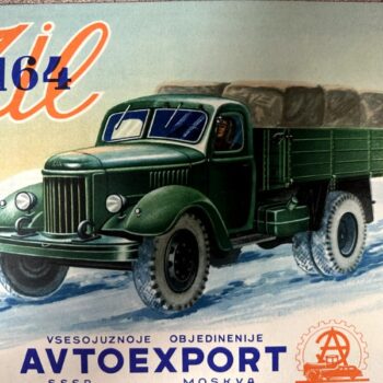 IMG_9542 | Merrick Auto Museum Green vintage truck hauling bales on a snowy road, advertising Avtoexport (ZIL 164).