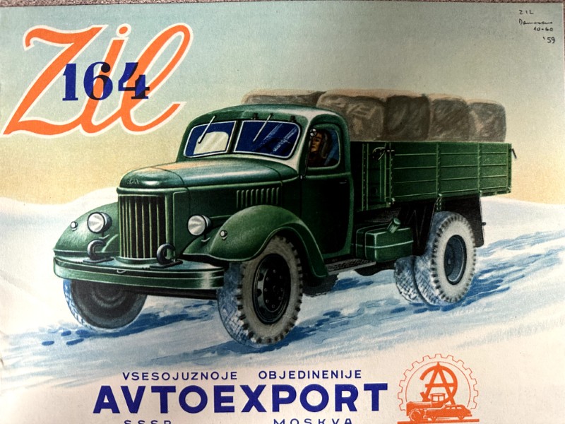 IMG_9542 | Merrick Auto Museum Green vintage truck hauling bales on a snowy road, advertising Avtoexport (ZIL 164).