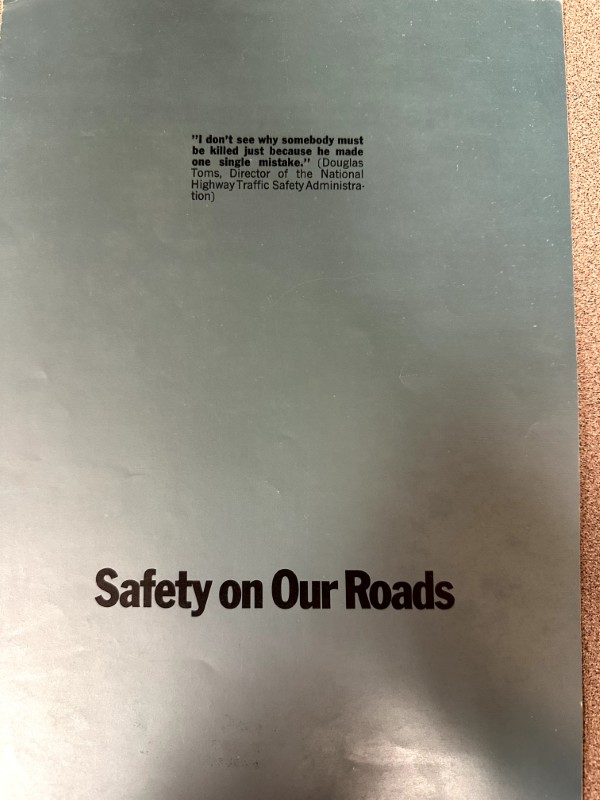 IMG_9652 | Merrick Auto Museum Front cover of a pamphlet titled 'Safety on Our Roads' with a small quotation about not killing someone for one mistake, attributed to Douglas Toms of the National Highway Traffic Safety Administration.