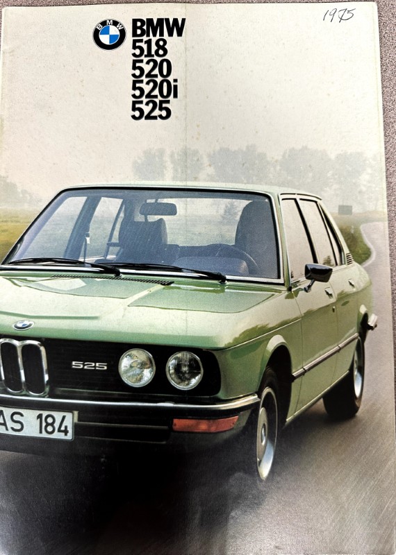 IMG_9664 | Merrick Auto Museum Green BMW 525 sedan shown on a vintage brochure cover with BMW logo and model numbers 518, 520, 520i, 525 at the top persistently printed in bold black text.
