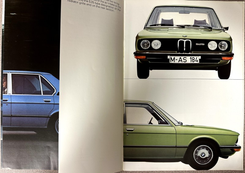 IMG_9665 | Merrick Auto Museum Front-facing green BMW 525 on a white page, license plate M-AS 184, with a side view of a matching green car below on the right page.