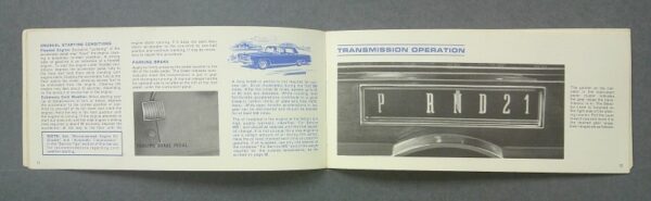 Imperial2 Custom | Merrick Auto Museum Open car manual spread showing transmission operation; right page has a dashboard plate reading PRND21 and part of the gear lever, left page contains text and a small illustration of a car and parking brake pedal.