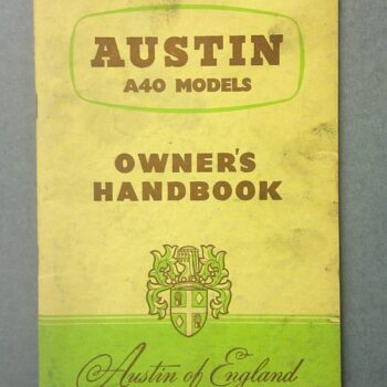 Austin A40 Models Owner's Handbook cover with a green crest and Austin of England lettering on a faded yellow page.