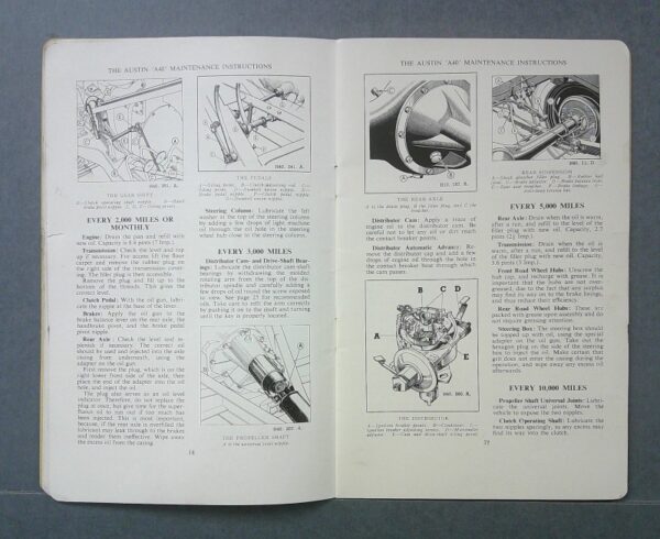 a402 Custom | Merrick Auto Museum Open book showing a two-page spread of Austin A40 maintenance instructions with black-and-white line drawings of gears, pedals, distributor, and suspension.